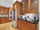 Stylish kitchen with stainless steel appliances, wood cabinetry, and granite countertops at 130 Holly Reserve Pkwy, Canton, GA 30114