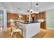 Spacious kitchen with large island, seating, stainless appliances, and abundant cabinet space at 130 Holly Reserve Pkwy, Canton, GA 30114