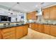 Spacious kitchen featuring custom cabinetry, granite countertops, modern appliances, and stylish lighting at 130 Holly Reserve Pkwy, Canton, GA 30114