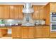 Well-equipped kitchen with stainless steel appliances, granite countertops, and custom cabinetry at 130 Holly Reserve Pkwy, Canton, GA 30114