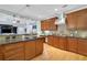 Open kitchen featuring a central island, wood floors, and sleek, stainless steel appliances at 130 Holly Reserve Pkwy, Canton, GA 30114