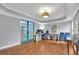 Home office featuring hardwood floors, blue barn doors, desk, and modern lighting at 130 Holly Reserve Pkwy, Canton, GA 30114