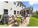 Outdoor patio with a fire pit, seating, and grill; perfect for entertaining and relaxation at 2213 Independence Ln, Buford, GA 30519