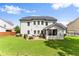 Spacious backyard featuring a patio, screened porch, and well-maintained lawn at 2213 Independence Ln, Buford, GA 30519