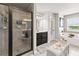 A bathroom shows a glass shower door, tub and dark wood vanity at 2213 Independence Ln, Buford, GA 30519