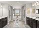 Bathroom with dual sink vanity, a soaking tub, and bench seat at 2213 Independence Ln, Buford, GA 30519