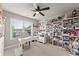 Well-lit craft room featuring custom shelving, desk space, and storage solutions at 2213 Independence Ln, Buford, GA 30519
