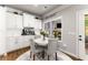 Cozy dining area with views of the fireplace and backyard at 2213 Independence Ln, Buford, GA 30519