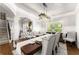 Elegant dining room featuring a stylish table, decorative lighting, and access to other rooms at 2213 Independence Ln, Buford, GA 30519