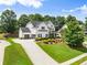 Beautiful two-story traditional home with a lush green yard and ample parking at 2213 Independence Ln, Buford, GA 30519