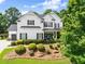 Charming two-story traditional home boasting a manicured lawn and tasteful landscaping at 2213 Independence Ln, Buford, GA 30519