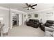Cozy living room featuring neutral tones, a ceiling fan, and decor accents at 2213 Independence Ln, Buford, GA 30519