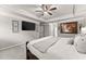 A spacious main bedroom features trey ceiling, large bed, and a television at 2213 Independence Ln, Buford, GA 30519