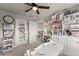 Bright home office featuring custom shelving, cabinets, and a desk space at 2213 Independence Ln, Buford, GA 30519