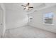 Spacious bedroom with a ceiling fan, trey ceilings and natural light from two large windows at 377 Danville Ave, Suwanee, GA 30024