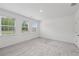 Bedroom with plush carpeting, natural lighting, and plenty of space for furnishings at 377 Danville Ave, Suwanee, GA 30024