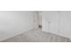 Bedroom featuring neutral carpet, light walls and a closet at 377 Danville Ave, Suwanee, GA 30024