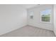 Bright bedroom featuring neutral carpet and two sunny windows at 377 Danville Ave, Suwanee, GA 30024