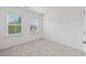 Bedroom featuring neutral carpet, light walls and two sunny windows at 377 Danville Ave, Suwanee, GA 30024