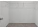 Spacious walk-in closet with wire shelving and carpeted floor at 377 Danville Ave, Suwanee, GA 30024
