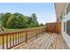 Wood deck overlooking green space with wooden railings and wooden privacy screen at 377 Danville Ave, Suwanee, GA 30024