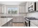 Modern kitchen with granite countertops, stainless appliances, and plenty of natural light at 377 Danville Ave, Suwanee, GA 30024