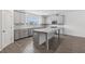 Well-equipped kitchen featuring sleek countertops, stainless steel appliances, and an island for cooking at 377 Danville Ave, Suwanee, GA 30024