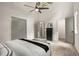 This bedroom features a gray door, gray-tone hard wood floor, and a modern ceiling fan at 515 Dover St, Marietta, GA 30066