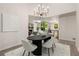 Dining room with statement lighting fixture and open layout, great for entertaining at 515 Dover St, Marietta, GA 30066