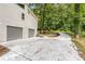 Driveway leading to a 2-car garage and home nestled on a wooded lot offering both convenience and privacy at 515 Dover St, Marietta, GA 30066