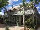 Contemporary commercial building with a shaded patio and large glass windows, surrounded by landscaping at 515 Dover St, Marietta, GA 30066