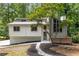 Charming home featuring a unique architectural design, complemented by lush landscaping at 515 Dover St, Marietta, GA 30066
