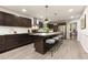 Modern kitchen with island seating, stainless steel appliances, and updated cabinetry at 515 Dover St, Marietta, GA 30066