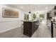 Stylish kitchen featuring a center island with seating, modern appliances, and elegant lighting at 515 Dover St, Marietta, GA 30066
