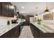 Gourmet kitchen features granite countertops, stainless steel appliances, and dark wood cabinetry at 515 Dover St, Marietta, GA 30066