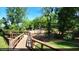 Beautiful boardwalk leading to play area with mature trees at 515 Dover St, Marietta, GA 30066