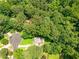 Aerial view of neighborhood in wooded area with homesites on a cul-de-sac at 5848 Kingswood Ct, Norcross, GA 30093
