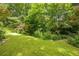 Beautiful backyard with lush greenery and manicured lawn at 5848 Kingswood Ct, Norcross, GA 30093