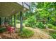 Scenic backyard featuring lush greenery and well-maintained landscaping with a stone pathway at 5848 Kingswood Ct, Norcross, GA 30093