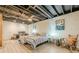 Finished basement bedroom with exposed ceiling, twin beds, and desk work space at 5848 Kingswood Ct, Norcross, GA 30093