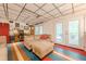 Finished basement with comfortable seating, a work area, and access to the outdoors, creating a versatile living space at 5848 Kingswood Ct, Norcross, GA 30093