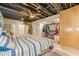 Basement bedroom with twin beds and open closet storage at 5848 Kingswood Ct, Norcross, GA 30093