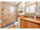 A well-maintained bathroom offers a glass shower, a toilet, and a wooden vanity at 5848 Kingswood Ct, Norcross, GA 30093