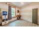 A cozy bedroom showcases a ceiling fan, a side table, and a window at 5848 Kingswood Ct, Norcross, GA 30093