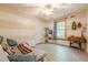 A cozy bedroom showcases a ceiling fan, a side table, and a window at 5848 Kingswood Ct, Norcross, GA 30093