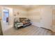 A simple bedroom features stylish floors and an adjoining doorway at 5848 Kingswood Ct, Norcross, GA 30093