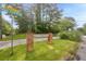 Stone community sign for Pebble Creek in a grass median at 5848 Kingswood Ct, Norcross, GA 30093
