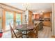 Dining area with sliding doors and a view of the kitchen's black and white backsplash at 5848 Kingswood Ct, Norcross, GA 30093