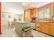 Open kitchen featuring an island with seating and a view into the dining area at 5848 Kingswood Ct, Norcross, GA 30093