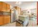 Spacious kitchen flowing into dining area, equipped with modern appliances and ample storage at 5848 Kingswood Ct, Norcross, GA 30093